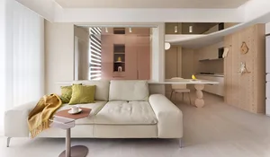 A modern living room with neutral-toned decor and minimalistic design.