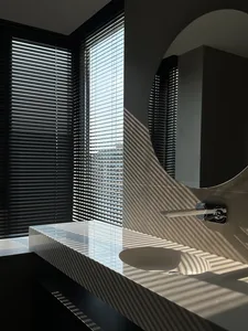 Toilet seat with white lid in minimalist bathroom