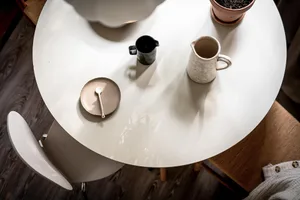A minimalist interior featuring ceramic utensils and wooden elements.