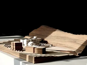 Model of an abstract urban plan constructed from wood and paper.