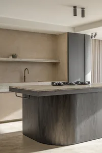 Modern kitchen with wooden island, sink, and stove.