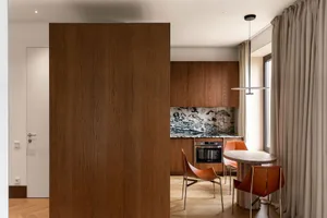 Modern kitchen with wooden accents and marble countertop