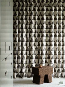 Modern interior design featuring black and white patterned curtains.