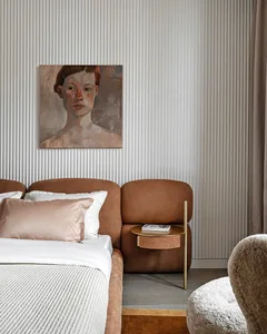 A modern minimalist bedroom features flannel cushions and a fabric texture on the headboard and bedding.