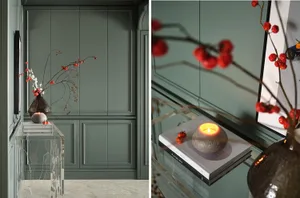 Modern living room with a glass side table featuring a decorative vase and lit candle.
