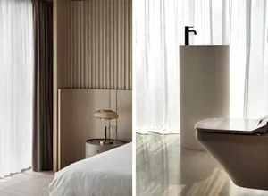 A minimalist bedroom with a wooden panel wall and a modern lamp on a side table.