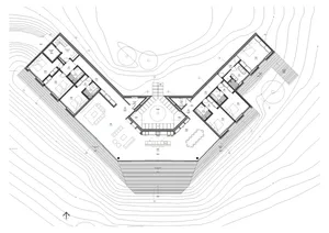 Floor plan of a modern residential building with multiple rooms and outdoor areas.
