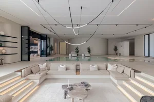 Interior design featuring modern minimalist living space with exposed concrete floors, wooden accents, and large glass walls.