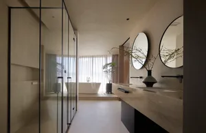 Modern minimalist bathroom with concrete and glass elements