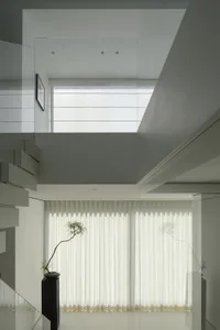 Modern minimalist architecture featuring transparent glass walls and panels.