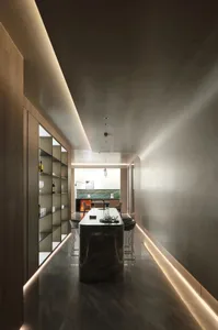 Modern kitchen with minimalist design featuring marble countertops and floor.