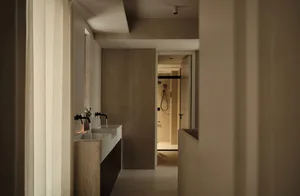 A modern bathroom featuring concrete tiles flooring and walls.