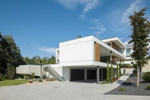 A Modern Residential House with a Concrete, Glass, and Wood Exterior