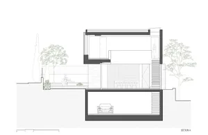 Cross-section of a modern residence with glass, concrete, and steel materials.