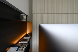A modern office setting featuring a concrete accent wall.