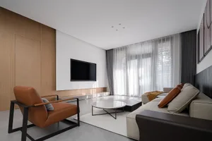 Modern living room with contemporary furniture, minimalist decor, and a sleek, contemporary style.