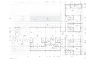 Detailed architectural blueprint of a modern residential floor plan featuring a mix of concrete, glass, and metal materials.