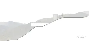 A minimalist house with a concrete facade and cliff edge location.