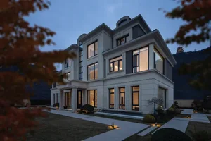 A modern house with exterior walls made of concrete and glass.