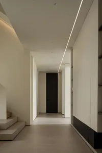 A modern interior space featuring concrete walls and floors.