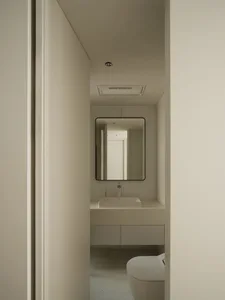 White concrete and terrazzo flooring in a minimalist bathroom