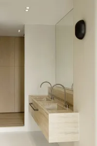 Modern bathroom with minimalist design featuring marble elements.