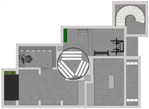 A detailed architectural floor plan of an industrial workspace featuring exposed concrete flooring.