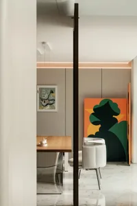 Modern dining room with marble floor and minimalist decor.
