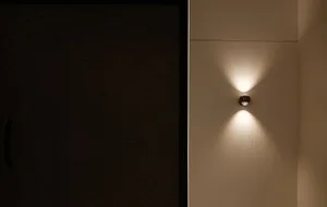 A modern example of steel lighting fixtures mounted on a wall.