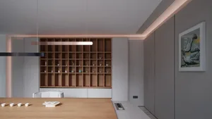 A modern, minimalist kitchen with wood finishes and clean lines.