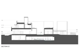 Sectional drawing of a modern house featuring concrete elements and a sectioned plan view.