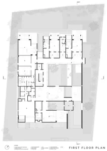 First floor architectural plan of a residential building with labeled rooms and outdoor areas.