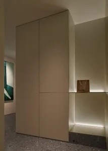 Modern minimalist entryway with white terrazzo flooring.