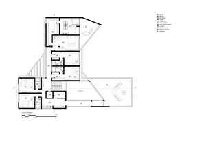 A detailed 2D architectural floor plan of a modern residential building with concrete features.