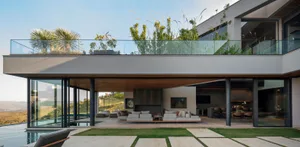 Modern residential interior featuring a concrete and glass design.