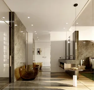 A modern bathroom featuring marble walls and flooring, with a free-standing brown glass tub and a minimalist design.