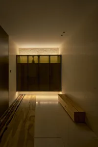 Modern architectural interior space with concrete and glass elements.