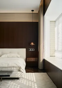 Modern bedroom interior with textured white cloth fabric, dark wooden panel wall, and minimalist design.