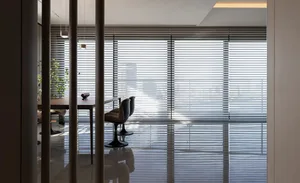 Modern residential office space with glass blinds