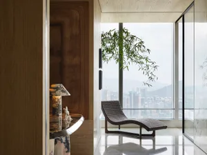 A modern living room featuring wooden texture and marble furniture.