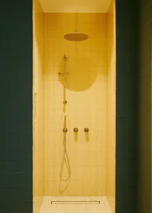 Yellow-tiled minimalist bathroom with modern fixtures.