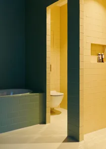 Modern bathroom with green and yellow cement tiles