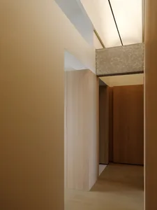 A minimalist closet with wooden paneling and clean lines.