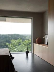 A modern interior space featuring a concrete floor and minimalist design.