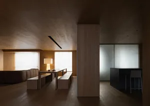 Modern living room with solid wood furniture, minimalist design, and natural light from large windows.