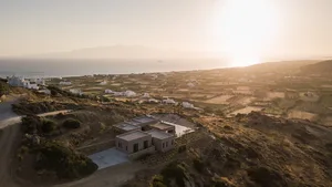 A minimalist residential house constructed with sandstone materials.