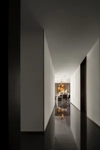 Modern dining room corridor featuring metallic chandelier