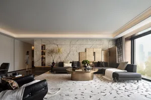 A modern minimalist living room featuring marble elements and a comfortable seating area.