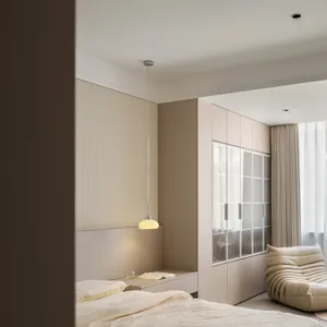Minimalist bedroom with taupe fabric and laminate finishes.