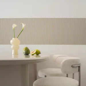 A minimalist white interior design with a white table, chairs, and a vase of white flowers, featuring textured white wall pan